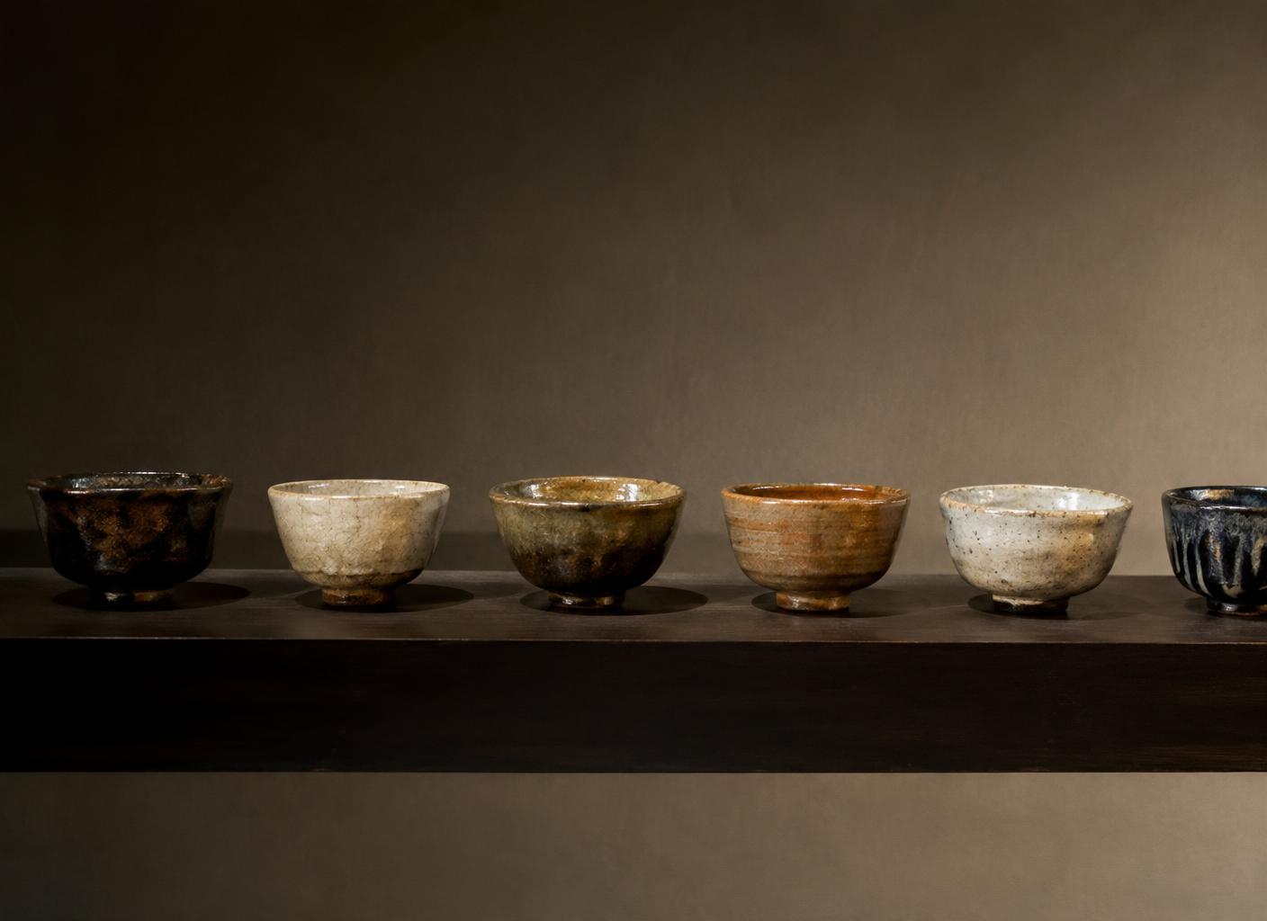 Handmade tea bowls on a shelf